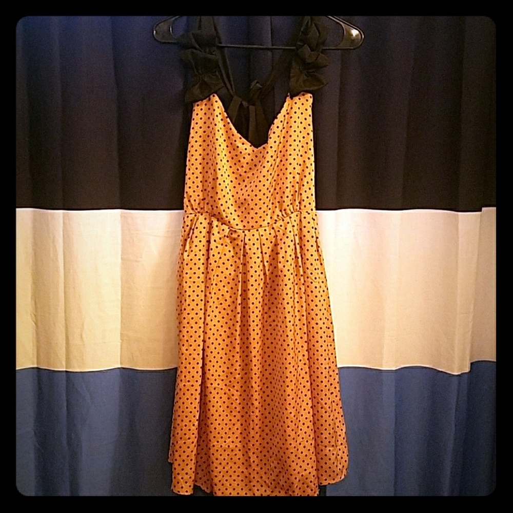 Peachy pink tie back dress with black polka dots